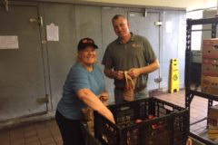 Susan and Lee making food bags